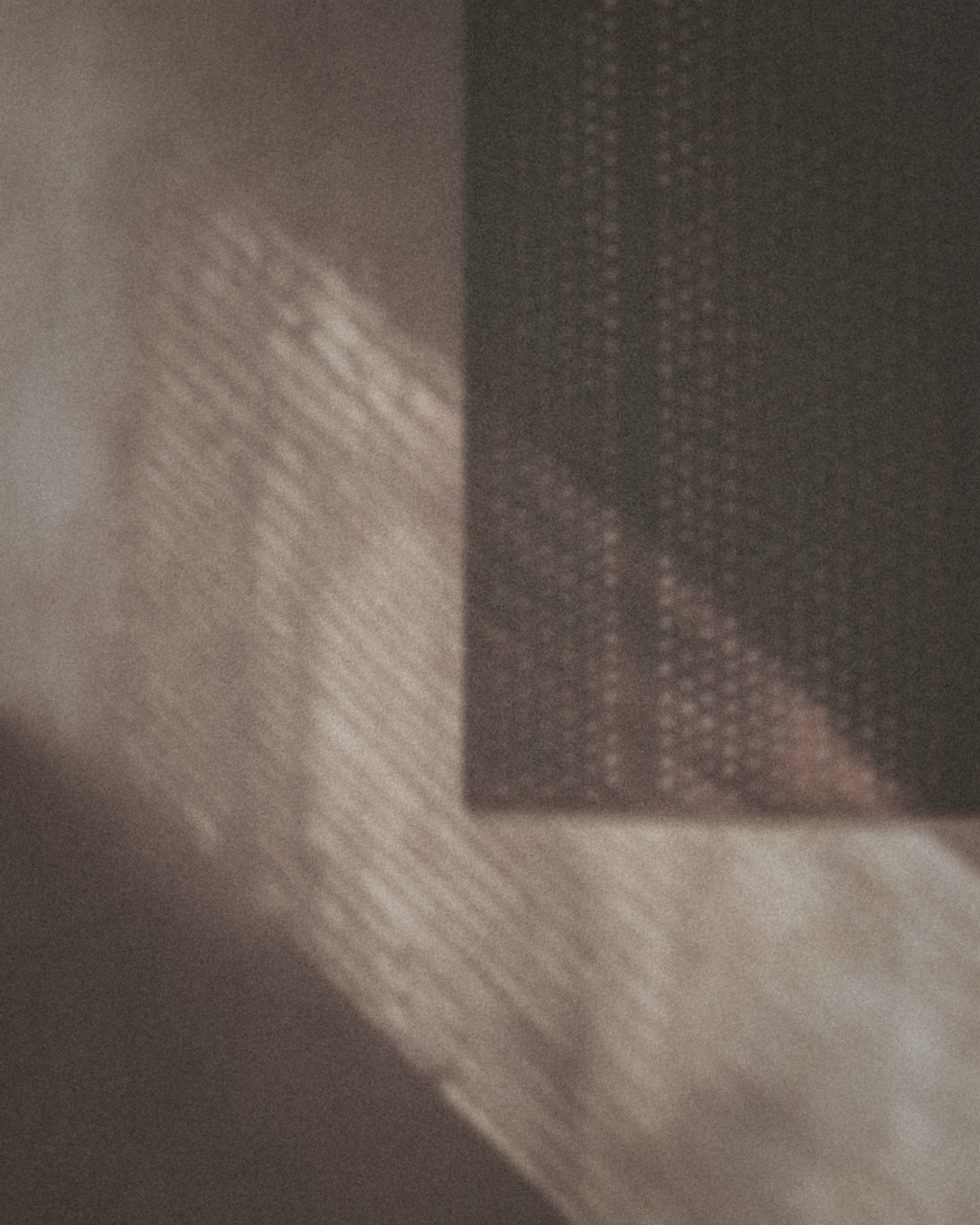 Oxidised steel mesh casting geometric shadows